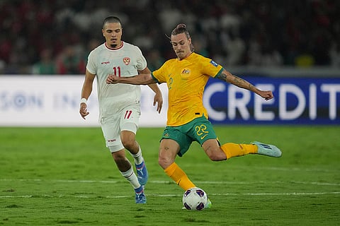 2026 FIFA World Cup Qualifying, Indonesia Australia: Indonesia's Ragnar Oratmangoen, left, battles for the ball against Australia's Jackson Irvine